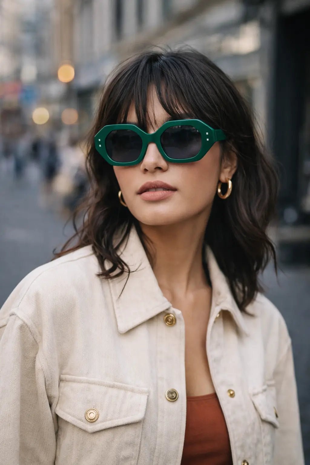 Model wearing Betty’s Retro Shades Bettina sunglasses in green