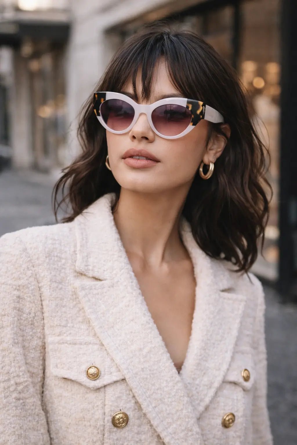 Model wearing Betty’s Retro Shades Carlotta sunglasses in white