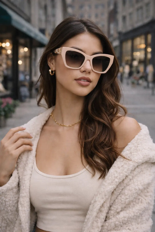 Model wearing Betty’s Retro Shades Celeste sunglasses in pink
