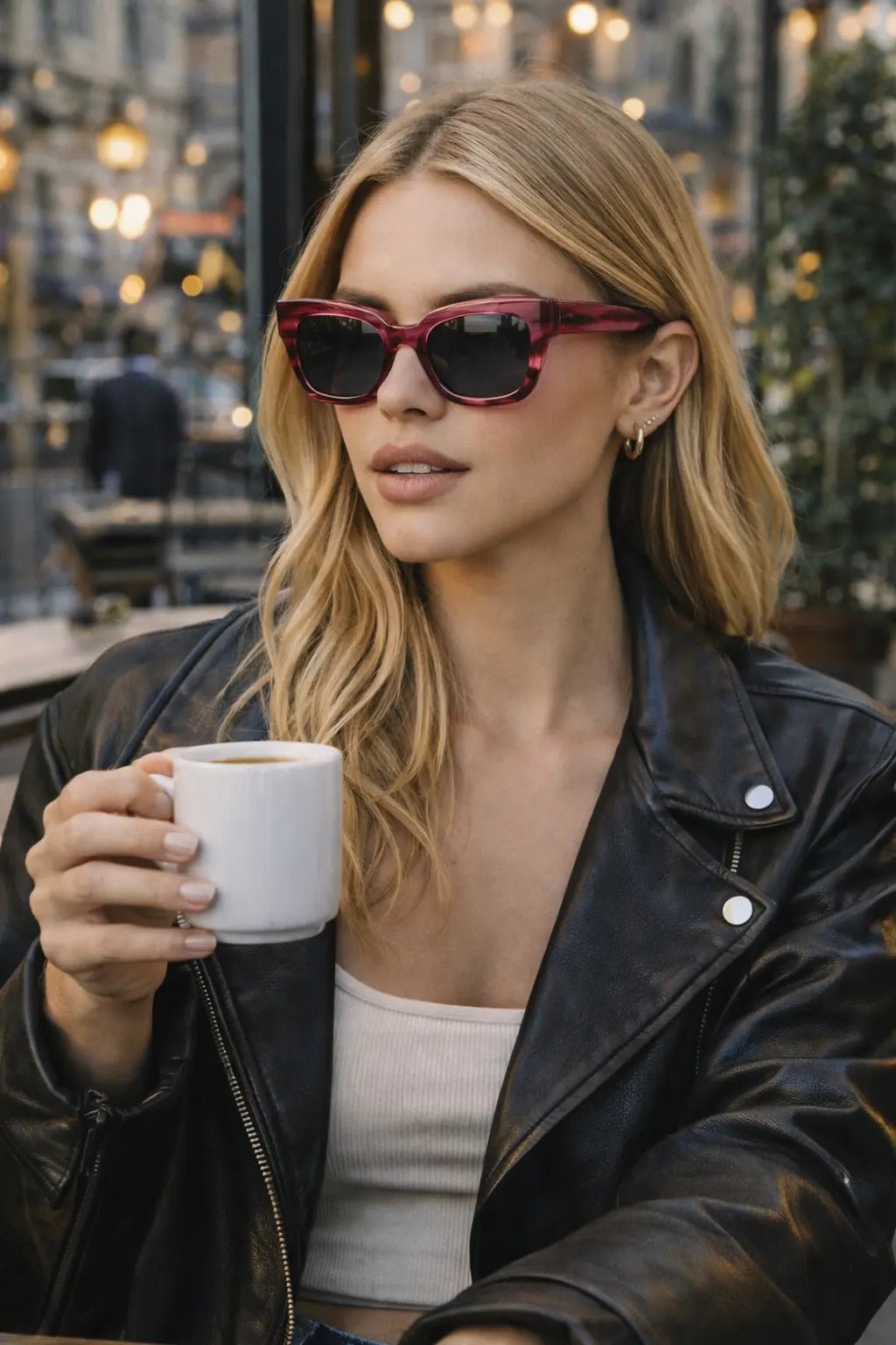 Model wearing Betty’s Retro Shades Cora sunglasses in marbled red