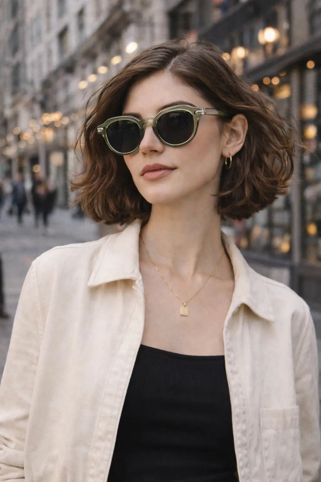 Model wearing Betty’s Retro Shades Mitzi sunglasses in translucent green